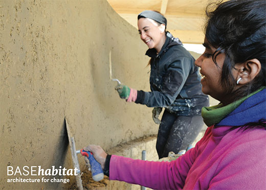 BASEhabitat – architecture for change Two women from diverse cultural backgrounds in the process of jointly plastering a curved earth plaster wall